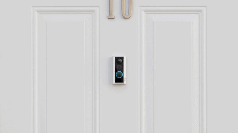 ring peephole camera installed on white door